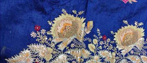 Gold floral dabka embroidery on royal blue.
