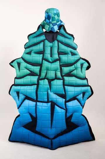 The checkerboard cape from the back, with puffed graffiti letters.