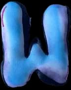 A puffed fabric letter W in pale blue.