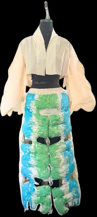 A toile on a dress form: cream kimono top over green puffed trousers.