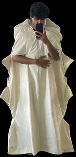 A mirror photo in a cream calico toile cape.