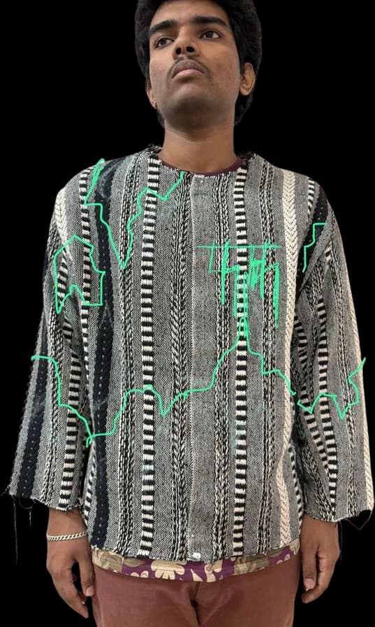 The striped and lace top worn, with its green stitch lines visible.
