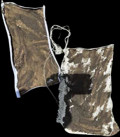 A panel of re-woven fabric remnants with a rough, irregular surface.